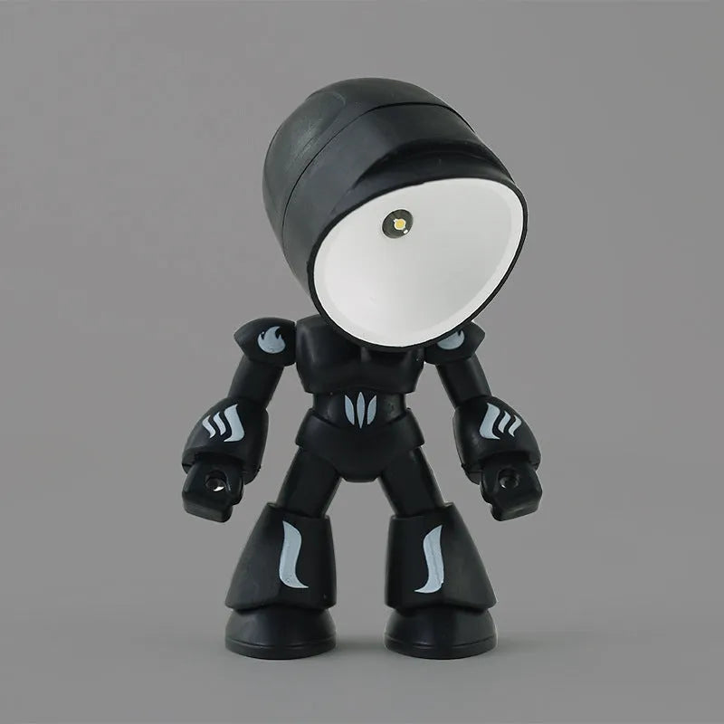 Mini mecha robot hero LED night light with adjustable arms on a desk.