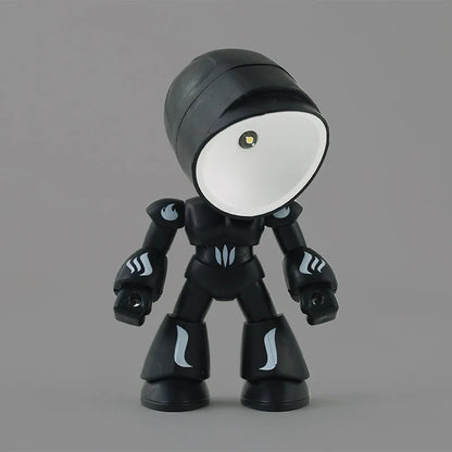 Mini mecha robot hero LED night light with adjustable arms on a desk.