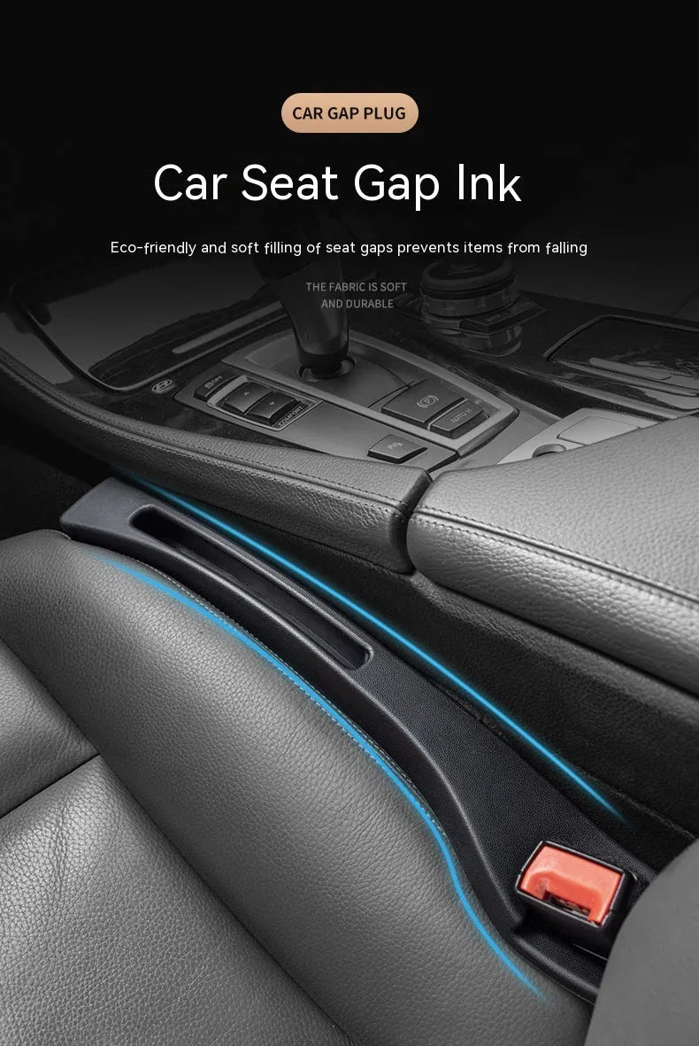 Black car seat gap storage box organiser with compartments and carrying handle between vehicle seats