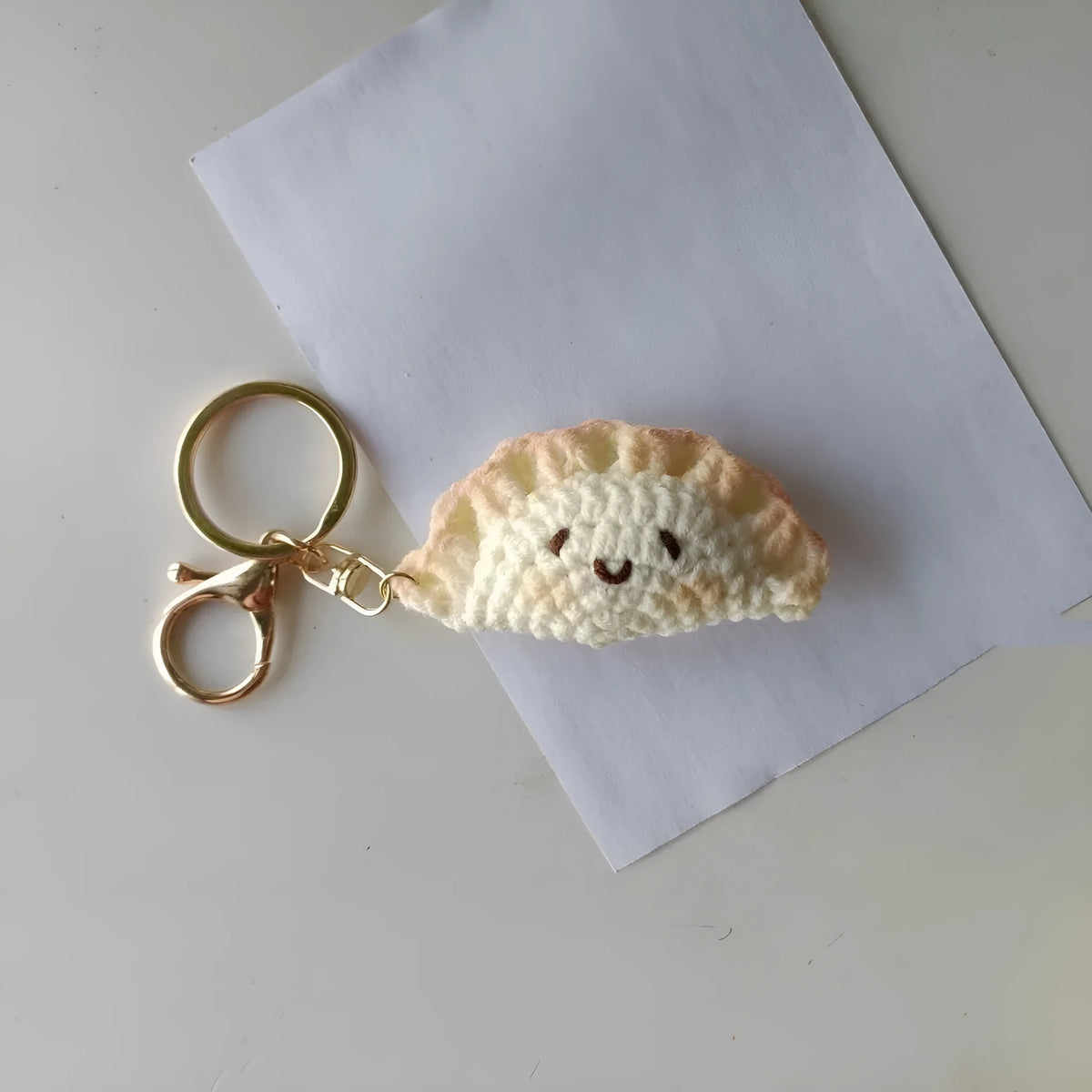 Handmade crochet dumpling pendant with keychain in plush fabric