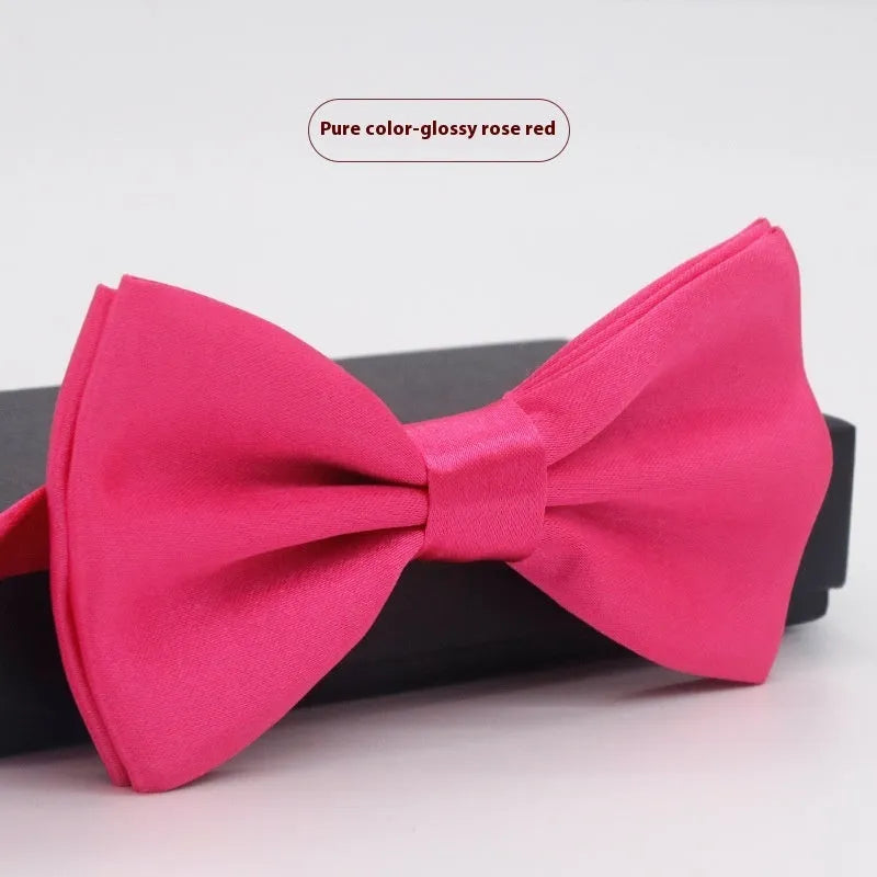 A solid colour pre-tied bow tie with an adjustable neck strap, shown in a classic flat head shape.