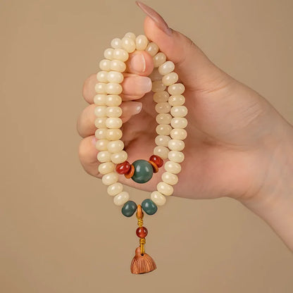 Cream-coloured wooden Bodhi root bracelet with flat round beads on 15-20cm wrist