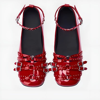 Women's black patent leather retro pumps with square toe and buckle closure on low flat heel