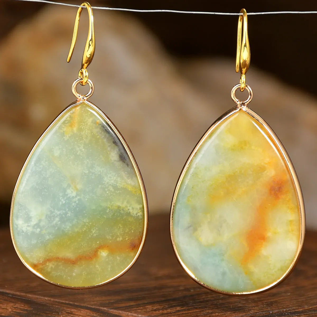 Women's retro-style drop earrings with a natural stone pendant in a water drop shape on an electroplated setting.
