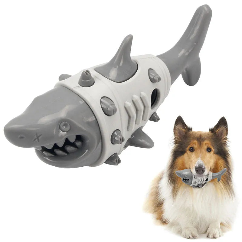 Blue, grey, and yellow plastic dog teething toy with shark-tooth texture and venting holes.