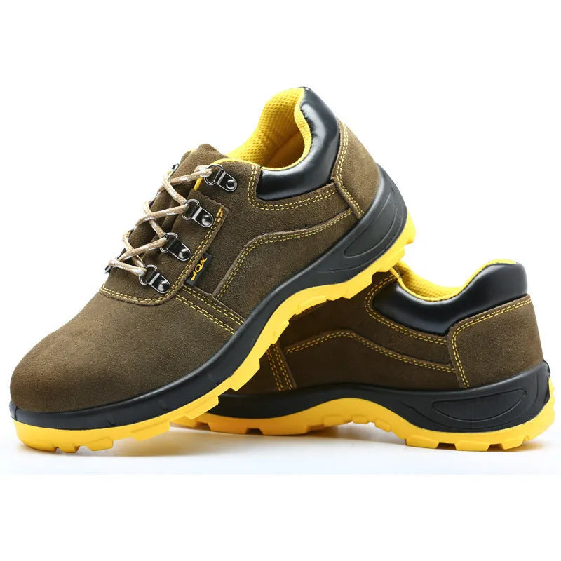 Bronze cow suede low-cut safety shoes with steel toe cap and patterned rubber sole on a workbench.