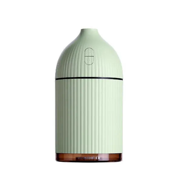 White ultrasonic aromatherapy diffuser and air humidifier with LED light, 300ml capacity, on a desk.