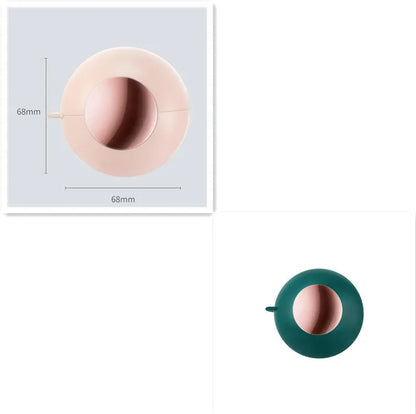 Reusable gel lint roller ball in green gold colour for removing pet hair and lint from fabrics.