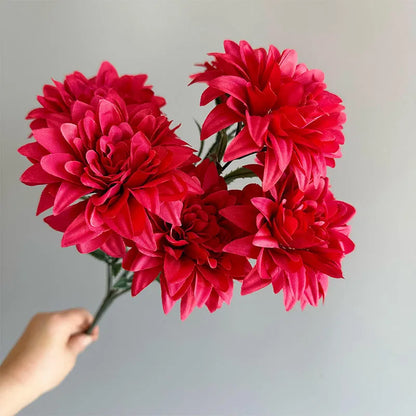 Desktop fan-shaped display holding artificial silk flowers in rose and peony varieties with colourful petals