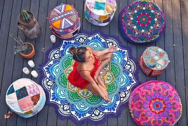 Round floor mat with polygon print and tassel trim, shown in available colours.