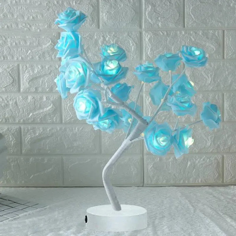 White and red rose flower LED lamp on a table with bonsai tree shape and warm white glow.