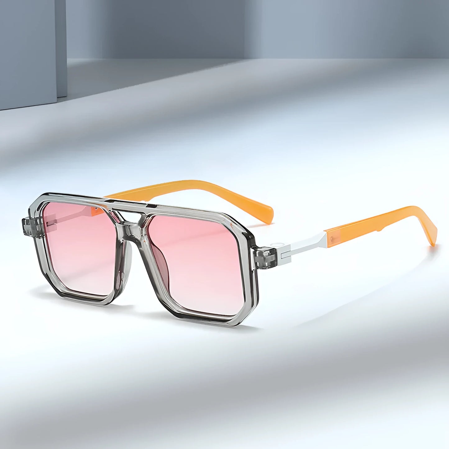 Retro style pilot sunglasses with a double beam metal frame and grey tinted lenses.