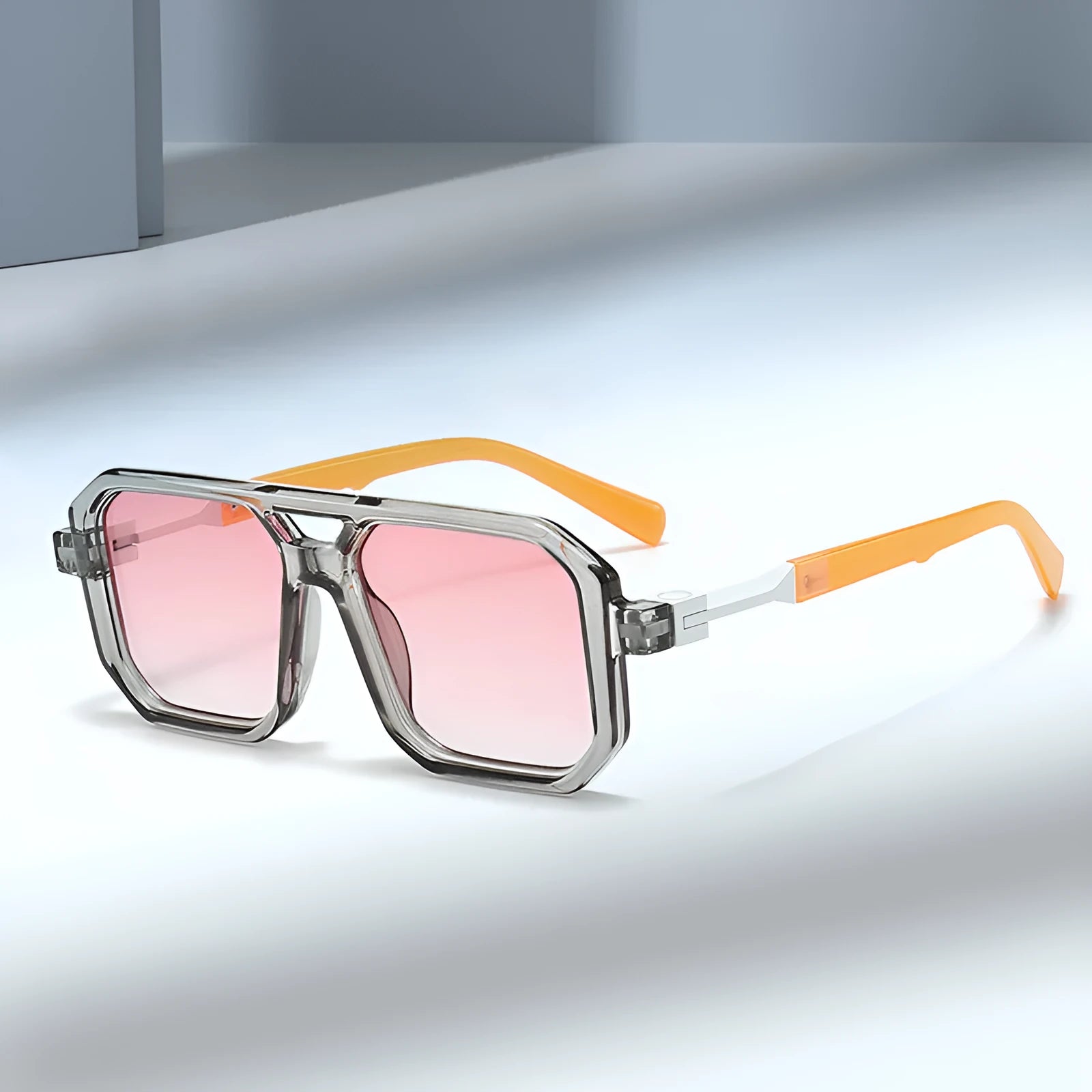 Retro style pilot sunglasses with a double beam metal frame and grey tinted lenses.