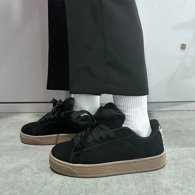 Black retro low-top sneakers with artificial PU upper, round toe and lace-up front closure on rubber sole