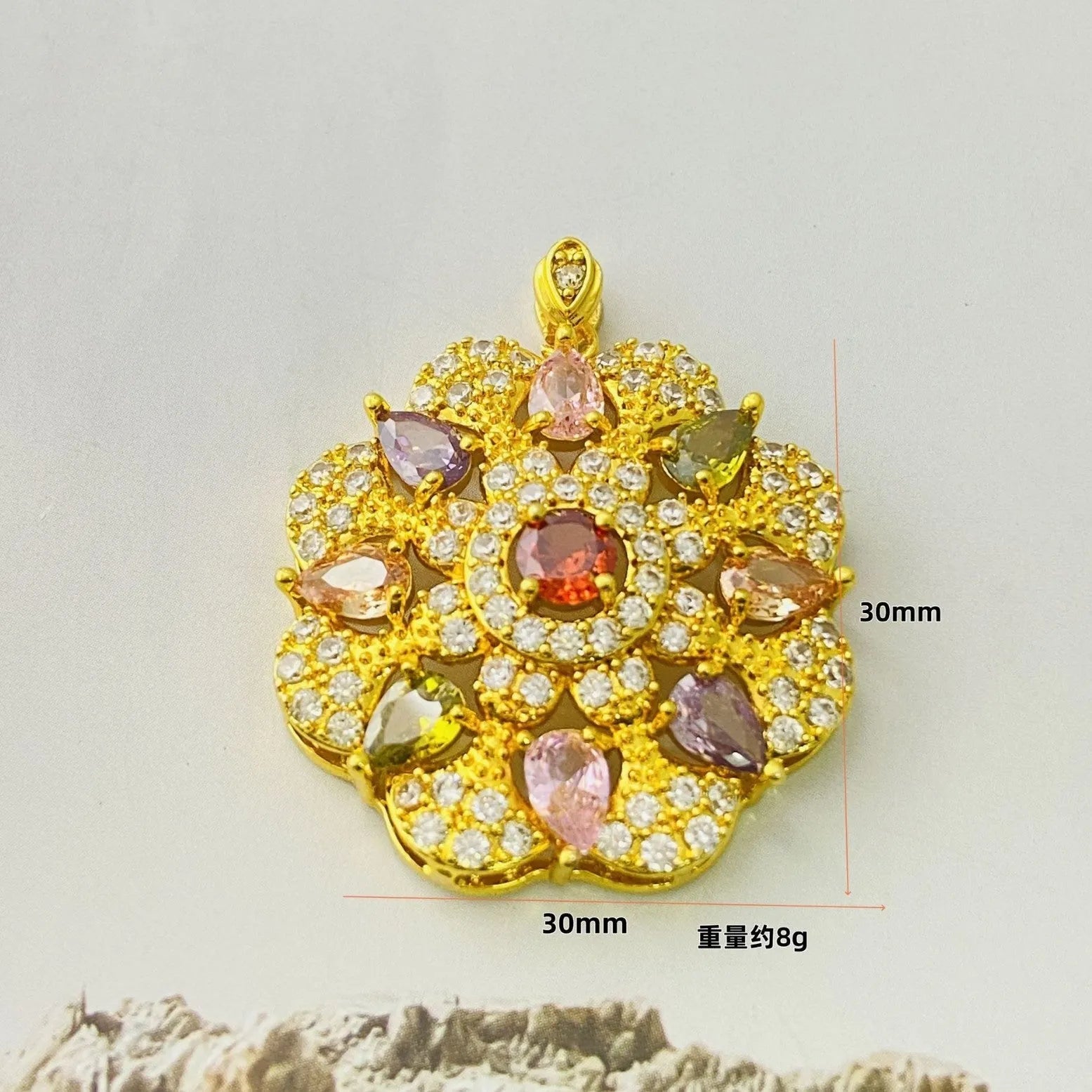 Close-up of a women's flower-shaped pendant necklace with a colourful zircon stone in a choice of gold, champagne gold, or platinum colour finishes.