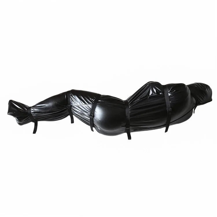 Black patent leather bondage harness set with six ratchet tie-down straps arranged for display