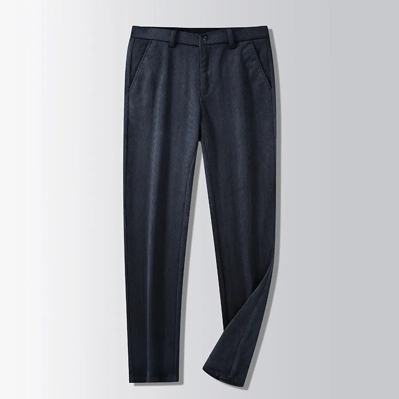 Man wearing khaki and black striped straight-leg retro trousers with a zip fly.