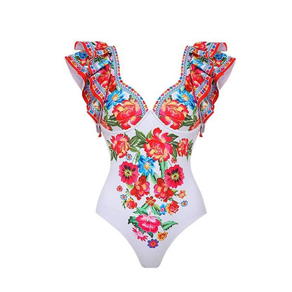 Women's printed one-piece swimsuit in rose pink on a mannequin.