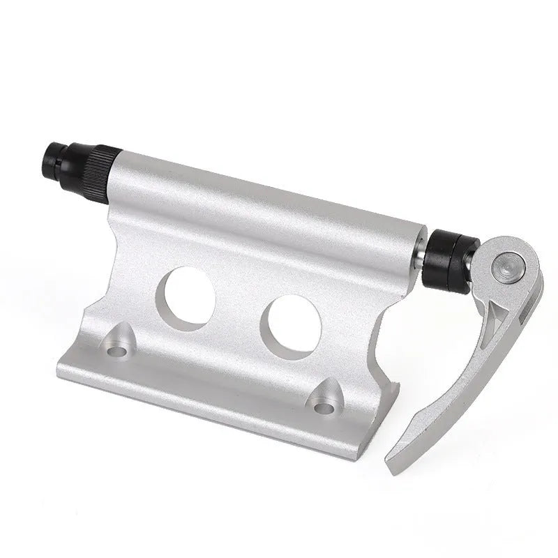 Silver metal bicycle front fork quick release clamp for mounting to a car bike rack.