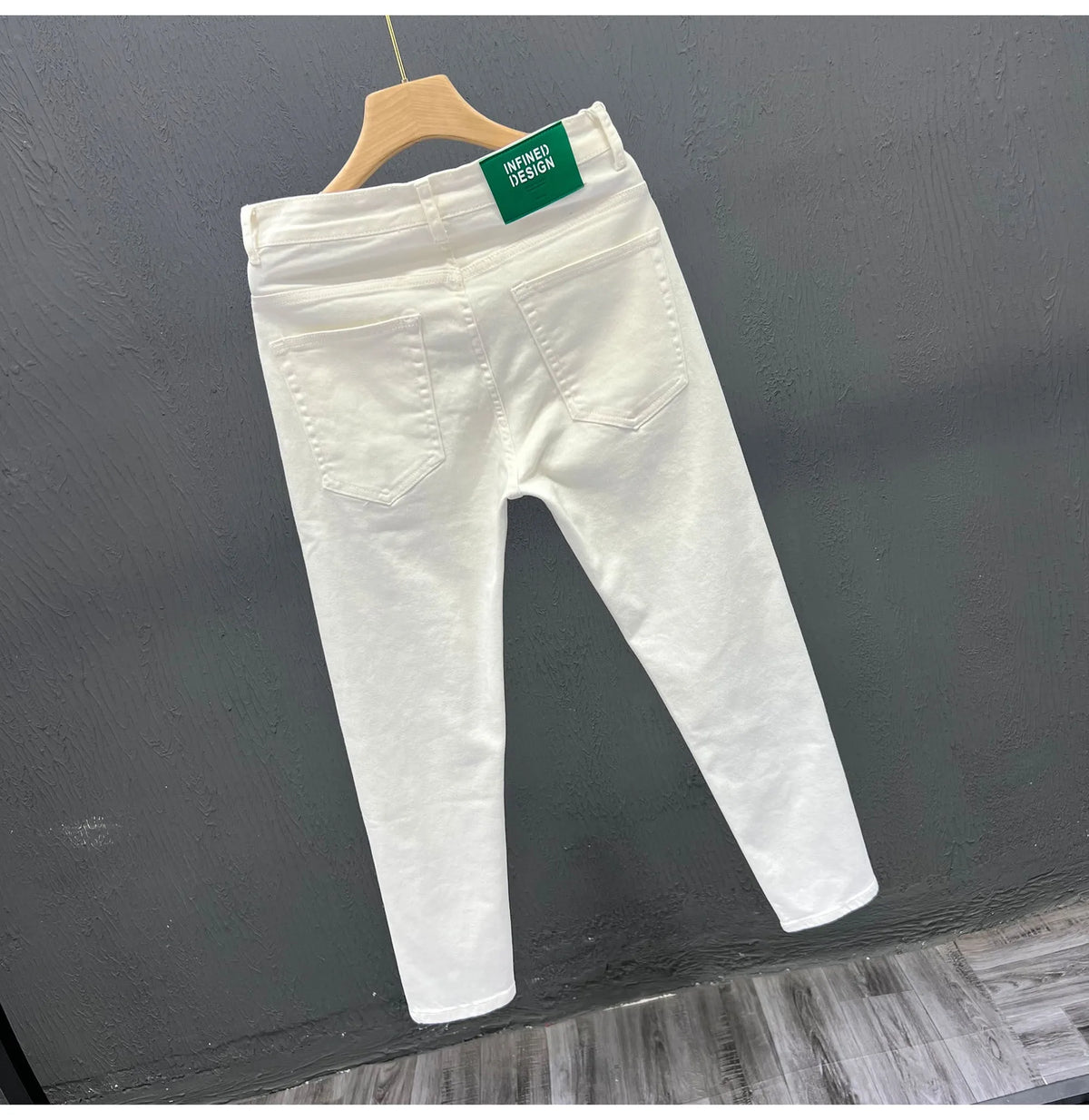 Men's white slim fit jeans with mid to low waist, micro elastic denim and small straight leg