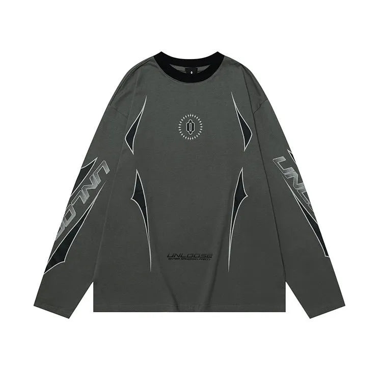 Woman wearing a grey khaki loose drop shoulder sweatshirt with a printed letter design.