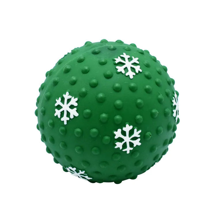 Red and green Christmas snowflake print dog chew ball with air vents, approx 7cm diameter.