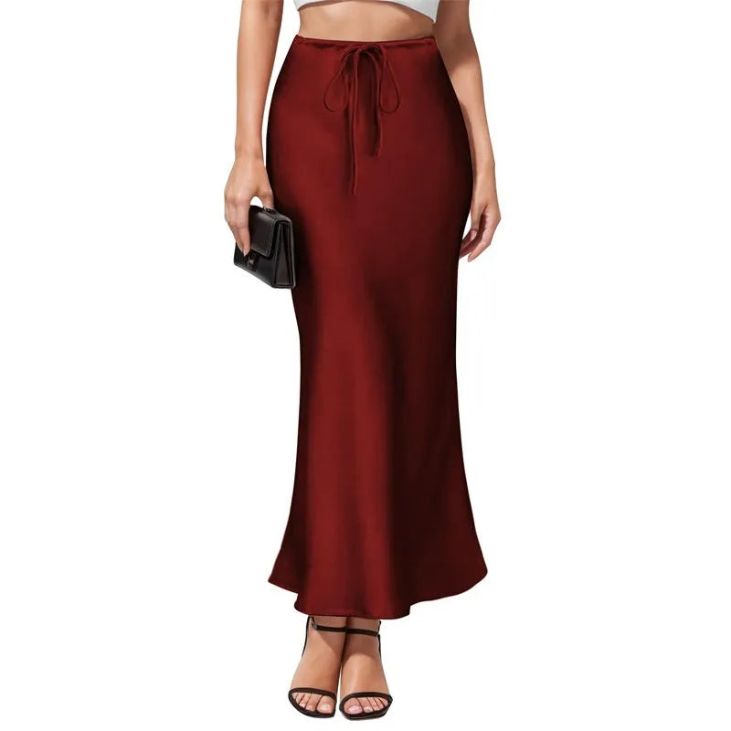 Asymmetric high waist acetate skirt with irregular stitching in multiple colour options.