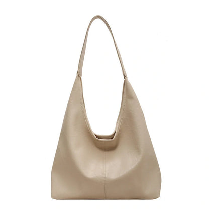 Classic vintage-inspired women's shoulder bag in a range of sophisticated colours, featuring a roomy interior, adjustable strap, and premium materials for timeless British style.