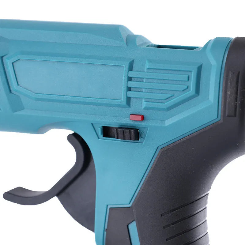 Cordless rechargeable hot melt glue gun with bare metal body, battery, charger, and pack of glue sticks.