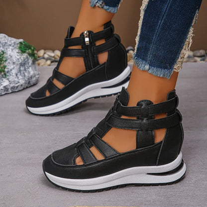 Black women's close-toed platform sandals with hollow-out design and Velcro strap.