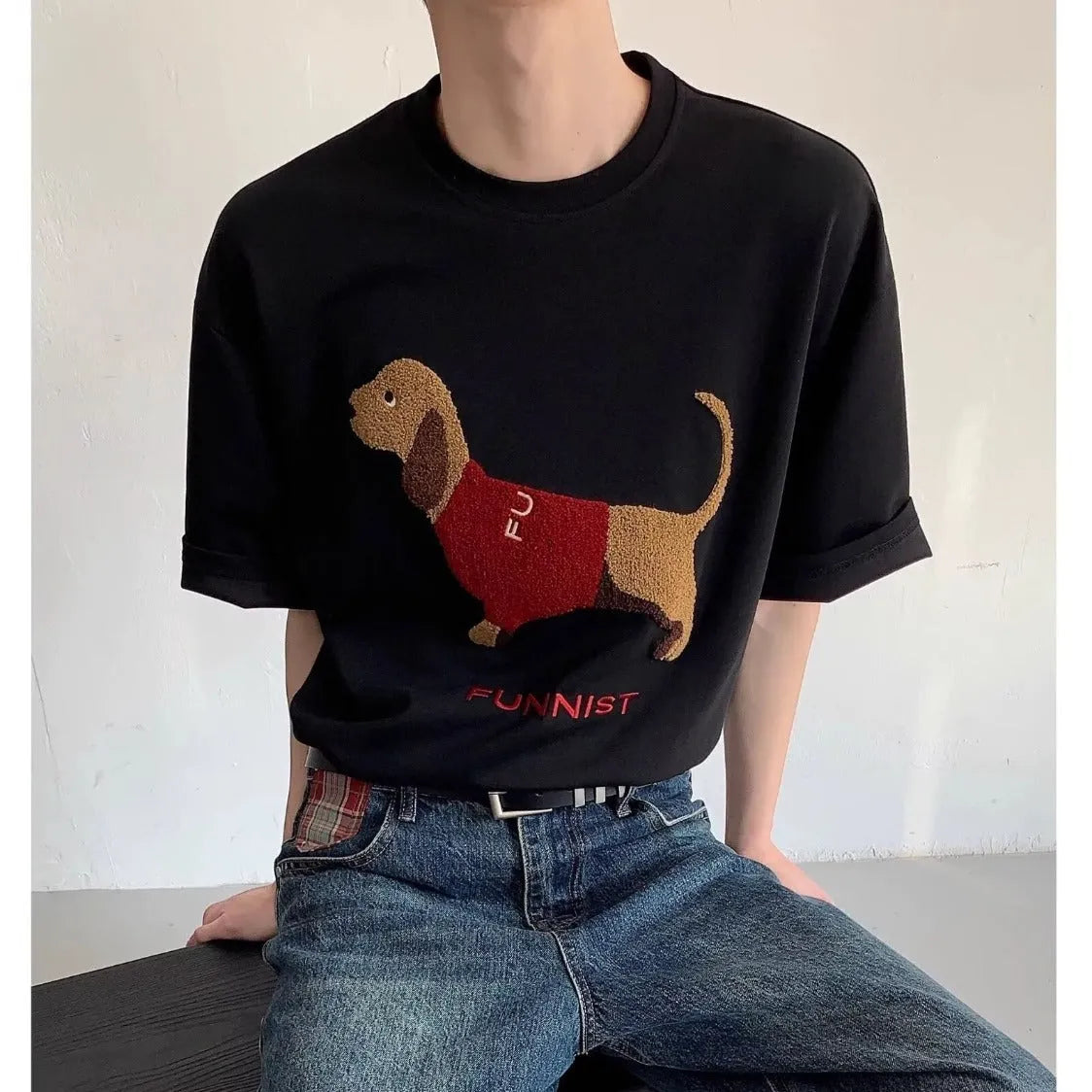 Men's black cotton T-shirt with embroidered sausage dog wrapped in a towel design