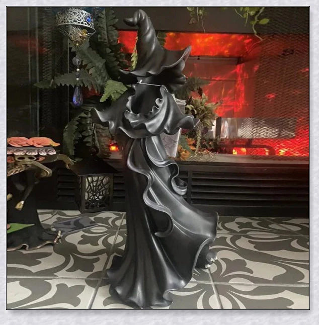 Witch With Lantern Decoration - A premium resin figurine that casts a mesmerising glow, adding enchantment to any space.