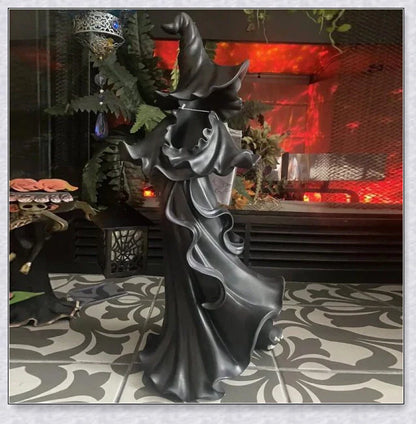 Witch With Lantern Decoration - A premium resin figurine that casts a mesmerising glow, adding enchantment to any space.
