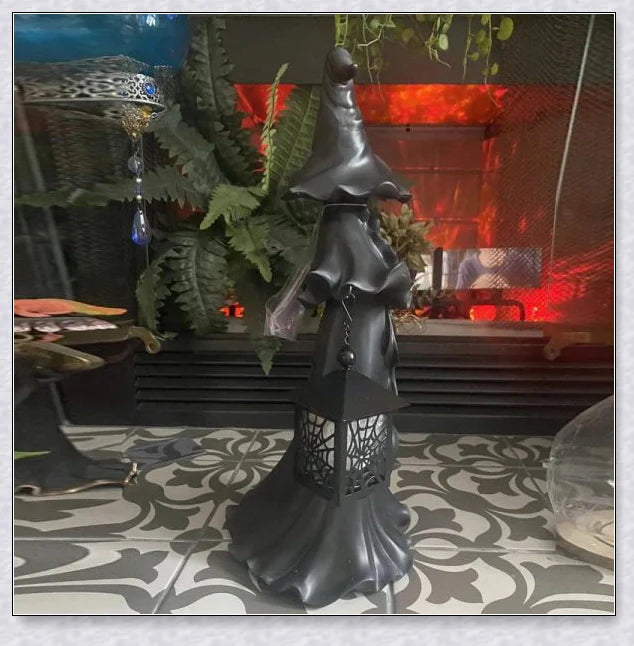 Witch With Lantern Decoration - A premium resin figurine that casts a mesmerising glow, adding enchantment to any space.