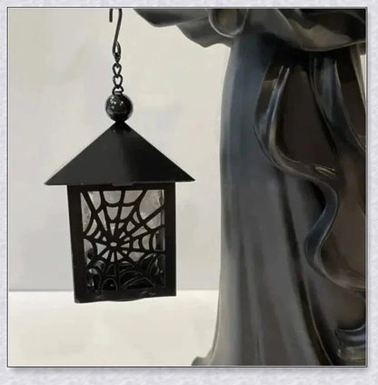 Witch With Lantern Decoration - A premium resin figurine that casts a mesmerising glow, adding enchantment to any space.
