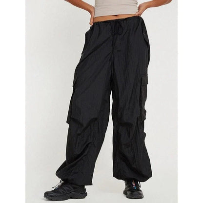 High-waist safari-style cargo trousers in black, featuring a comfortable, relaxed fit and unique design elements