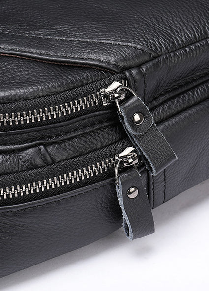 Durable leather messenger bag with adjustable shoulder strap and spacious main compartment for secure storage and organisation
