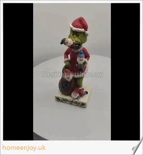 A resin garden statue depicting the Grinch sneakily enjoying a snack, surrounded by a group of jolly gnomes.