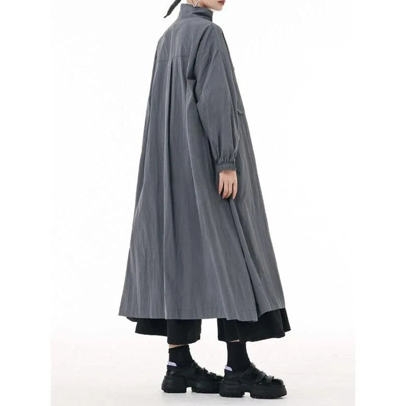 A stylish, army green trench coat with a zipper closure, mandarin collar, and functional pockets.