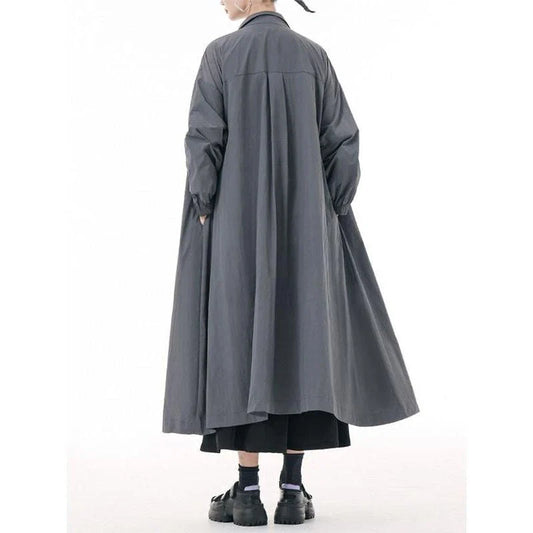 A stylish, army green trench coat with a zipper closure, mandarin collar, and functional pockets.