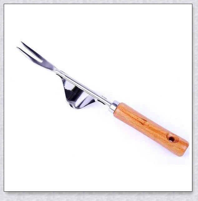 Stainless steel manual weed puller with curved base and sharp forks for efficient weed removal in UK gardens