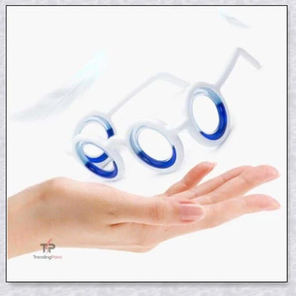 A pair of black motion sickness glasses with a blue liquid-filled ring to create an artificial horizon and relieve nausea, dizziness, and vertigo during travel.