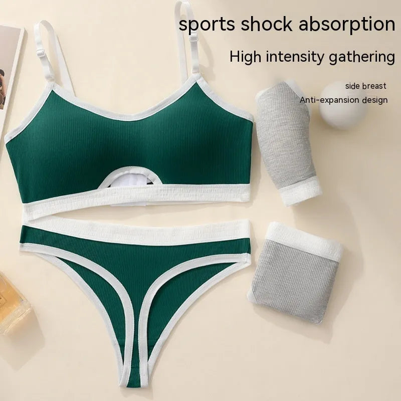 White underwired sports bra set with contrast dark grey back detailing and matching briefs on a mannequin.