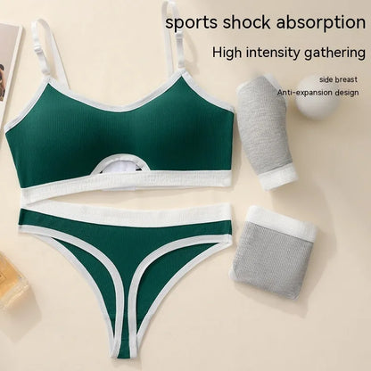 White underwired sports bra set with contrast dark grey back detailing and matching briefs on a mannequin.