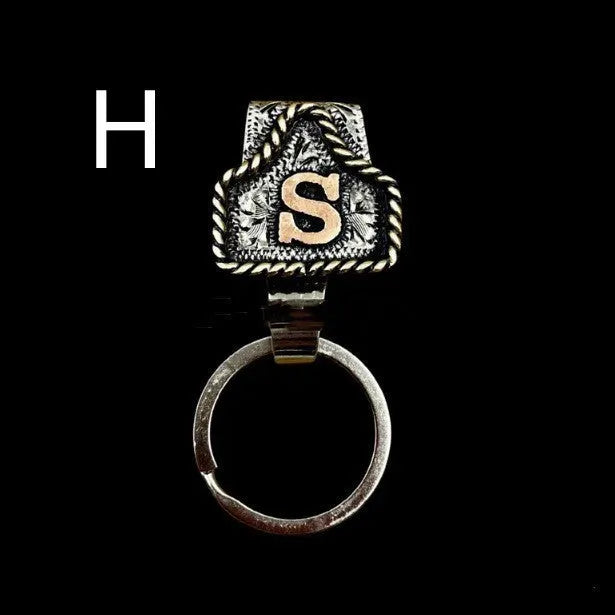 Handmade cow tag design metal keychain on a keyring, shown in one of many available colours.