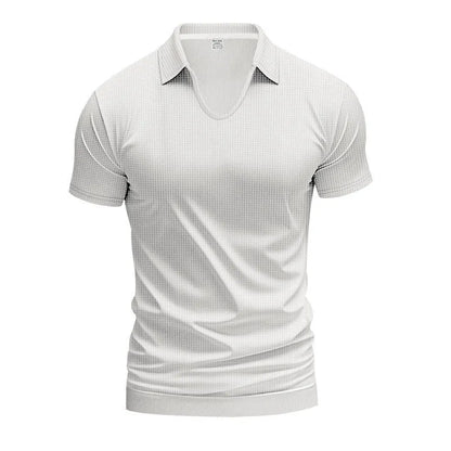 Man modelling a loose-fit apricot coloured V-neck short-sleeve T-shirt for casual summer wear.