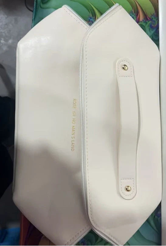 Premium PU leather cosmetic bag with large capacity, versatile storage, and water-resistant design for modern women on the go