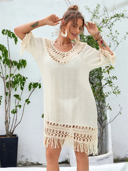 Hand-crocheted apricot beach dress for women on a beach