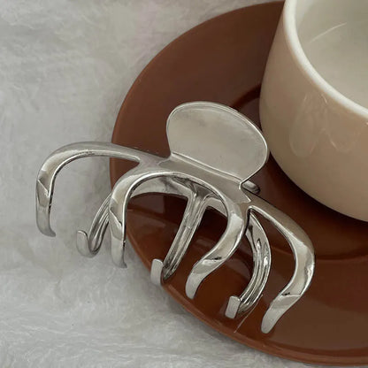 Silver metal hair claw barrette example from a range of 44 Korean-style designs.