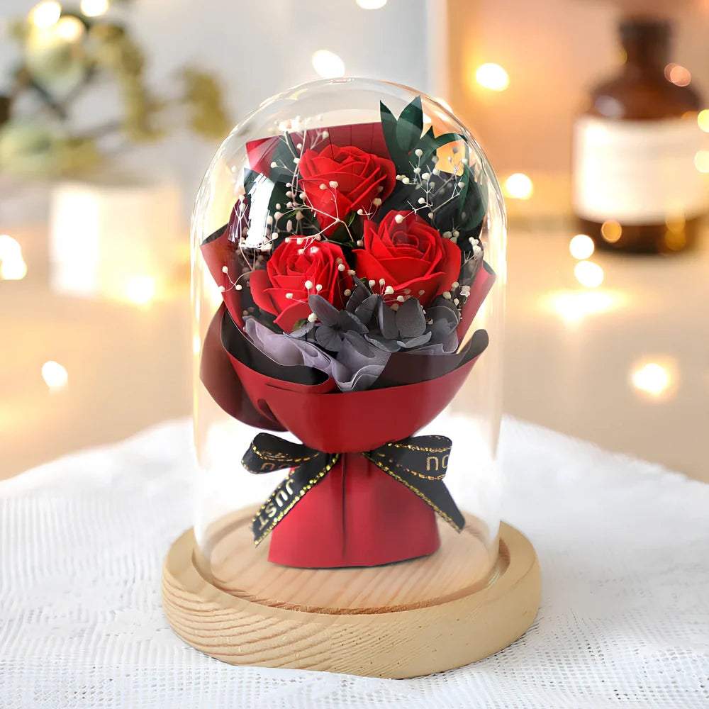 Soap flower bouquet in glass cover with red rose arrangement measuring 16cm height